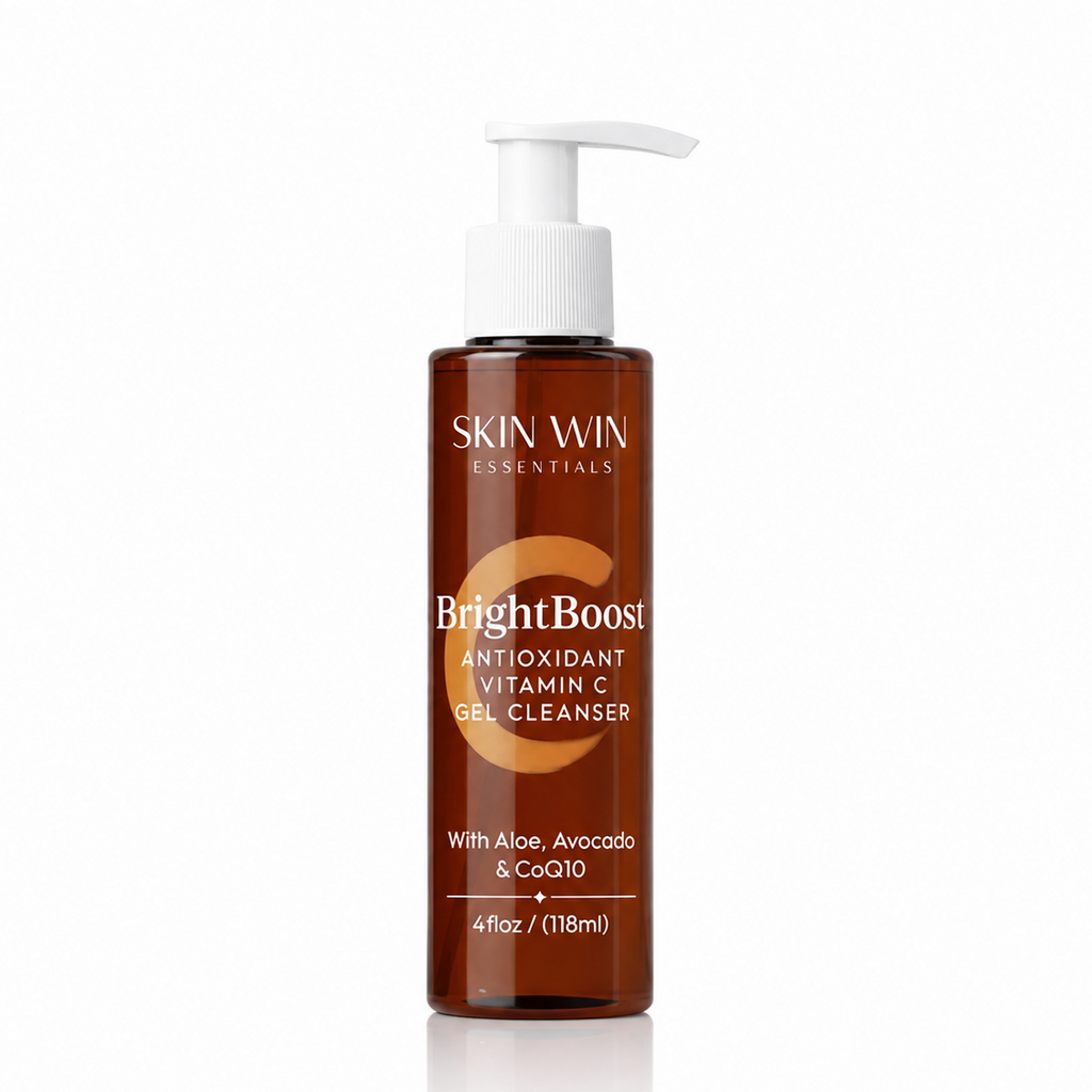 A bottle of Skin Win Essentials BrightBoost Antioxidant Vitamin C Gel Cleanser, featuring a white pump dispenser and a translucent amber-brown bottle, set against a clean white background with a subtle reflection.