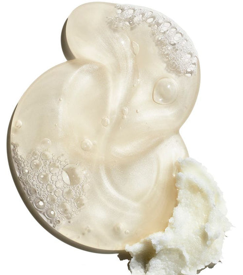 Close-up of a creamy substance with bubbles on a white background