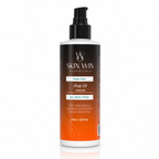 A bottle of Skin Win Essentials Cedar Noir Body Oil for men, featuring a black and orange gradient label with a black pump dispenser, set against a plain white background.