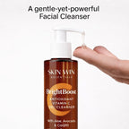 Bottle of Skin Win Essentials BrightBoost Antioxidant Vitamin C Gel Cleanser with a hand holding it.